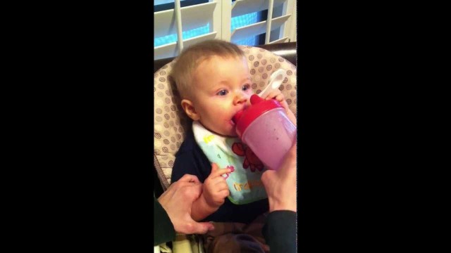 'Transformation Fitness Trainer Parents, Heidi & Chris Powell, feeding cute baby Cash Protein shake'