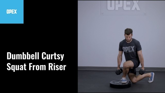 'Dumbbell Curtsy Squat From Riser - OPEX Exercise Library'