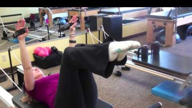 'Melanie Rogers Pilates Instructor at Fitness Quest 10 demonstrates Pilates Single Leg'